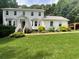 Charming two-story home with a well-manicured lawn and inviting front entrance at 4424 Lower Fayetteville Rd, Sharpsburg, GA 30277