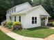 Side view of the home highlighting the manicured lawn and landscaping at 4424 Lower Fayetteville Rd, Sharpsburg, GA 30277