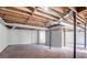 Spacious unfinished basement with concrete floor and exposed ductwork and support beams at 4641 Waterford Ct, Atlanta, GA 30338