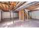 Spacious unfinished basement with stairs and exposed ductwork and support beams at 4641 Waterford Ct, Atlanta, GA 30338