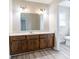 Bathroom features a vanity with dark wood cabinets, bright countertop, and a large mirror above the sink at 4641 Waterford Ct, Atlanta, GA 30338