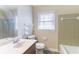 Bathroom with a single sink vanity and shower combo provides essential functionality in a compact space at 4641 Waterford Ct, Atlanta, GA 30338