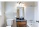 Bathroom featuring a vintage-style vanity and mirror with a standard tub and shower combination at 4641 Waterford Ct, Atlanta, GA 30338