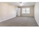 This spacious bedroom has gray carpet, one window, and a closet at 4641 Waterford Ct, Atlanta, GA 30338