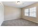 Bedroom with a closet offers a clean and comfortable space enhanced by natural light through the window at 4641 Waterford Ct, Atlanta, GA 30338