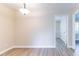 This dining room has wood floors, beige walls and a modern light fixture at 4641 Waterford Ct, Atlanta, GA 30338