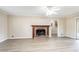 This living room has wood floors and a brick fireplace with mantel at 4641 Waterford Ct, Atlanta, GA 30338