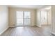 Inviting living room with neutral paint, two large windows, and contemporary flooring at 4641 Waterford Ct, Atlanta, GA 30338