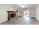 This living room has wood floors, a brick fireplace with mantel and sliding glass doors at 4641 Waterford Ct, Atlanta, GA 30338