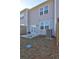 Backyard view with gray siding and patio at 534 Magnolia Cir, Palmetto, GA 30268