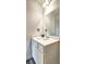 Bright bathroom featuring a white vanity, a modern faucet, and a decorative strawberry wall hanger at 534 Magnolia Cir, Palmetto, GA 30268