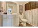 Bright bathroom featuring a white vanity, toilet, decorative shower curtain, and modern fixtures at 534 Magnolia Cir, Palmetto, GA 30268