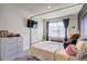 Light and airy bedroom with a canopy bed and a neutral color scheme at 534 Magnolia Cir, Palmetto, GA 30268