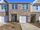 Charming two-story townhome with a one-car garage and inviting front entrance at 534 Magnolia Cir, Palmetto, GA 30268