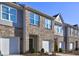 Beautiful brick townhome with a one-car garage and well-maintained landscaping at 534 Magnolia Cir, Palmetto, GA 30268