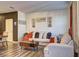 Inviting living room featuring hardwood floors, comfortable seating, and stylish decor at 534 Magnolia Cir, Palmetto, GA 30268