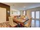 Open-concept living room with dining table, and modern furnishings near doors to a patio or balcony at 534 Magnolia Cir, Palmetto, GA 30268