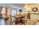 Open-concept living space with kitchen, dining area, and a comfortable seating area at 534 Magnolia Cir, Palmetto, GA 30268