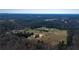 Scenic aerial view of a home nestled within a lush, wooded landscape, offering privacy and tranquility at 774 Forrester Cemetery Rd, Covington, GA 30014
