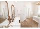 Bathroom featuring a soaking tub, dual sinks, and classic style, ideal for relaxation at 774 Forrester Cemetery Rd, Covington, GA 30014