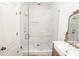 Bathroom with a glass-enclosed shower, neutral tiling, and modern fixtures at 774 Forrester Cemetery Rd, Covington, GA 30014