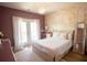 Bedroom featuring a bed, floral wallpaper and a balcony with white French doors at 774 Forrester Cemetery Rd, Covington, GA 30014