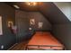 Stylish bedroom with a dark color palette and unique basketball-themed decor at 774 Forrester Cemetery Rd, Covington, GA 30014
