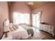 Spacious vaulted ceiling bedroom featuring an area rug, bright windows, and stylish decor at 774 Forrester Cemetery Rd, Covington, GA 30014