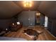 Bedroom featuring a bed, brown leather sofa, an ensuite bathroom and wood floors at 774 Forrester Cemetery Rd, Covington, GA 30014