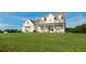 Attractive two-story home features a welcoming front porch, complemented by a well-maintained lawn at 774 Forrester Cemetery Rd, Covington, GA 30014
