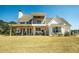 Covered porch area with ceiling fans and outdoor seating at 774 Forrester Cemetery Rd, Covington, GA 30014