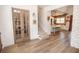 Open-concept foyer with French doors, staircase and view of kitchen with wood paneling and island at 774 Forrester Cemetery Rd, Covington, GA 30014