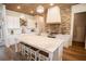 Bright, spacious kitchen features a large island, stainless appliances, and wood-look floors at 774 Forrester Cemetery Rd, Covington, GA 30014