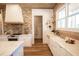 Bright kitchen featuring wood ceiling, stainless appliances, and a brick backsplash at 774 Forrester Cemetery Rd, Covington, GA 30014