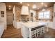 Bright, spacious kitchen features a large island, stainless appliances, and wood-look floors at 774 Forrester Cemetery Rd, Covington, GA 30014