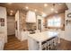 Modern kitchen with a wooden ceiling, brick backsplash, and stainless steel appliances at 774 Forrester Cemetery Rd, Covington, GA 30014