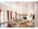 Airy living room featuring a cozy fireplace, plush seating, and natural light at 774 Forrester Cemetery Rd, Covington, GA 30014