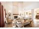 Bright and airy living room with a brick fireplace, hardwood floors, and modern decor at 774 Forrester Cemetery Rd, Covington, GA 30014