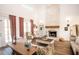 Spacious living room featuring a brick fireplace, hardwood floors, and elegant furnishings at 774 Forrester Cemetery Rd, Covington, GA 30014
