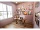 Cozy office space featuring a wooden desk, light wood floors and natural light at 774 Forrester Cemetery Rd, Covington, GA 30014