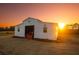 Rustic outbuilding featuring a convenient open bay, set against a backdrop of a vibrant sunset at 774 Forrester Cemetery Rd, Covington, GA 30014