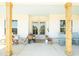 Inviting front porch with rocking chairs, wood pillars, and decorated entrance at 774 Forrester Cemetery Rd, Covington, GA 30014