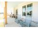 Inviting front porch with rocking chairs, wood pillars, and a light blue ceiling at 774 Forrester Cemetery Rd, Covington, GA 30014