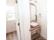 Quaint powder room featuring a stylish vanity, a vessel sink, and decorative mirror at 774 Forrester Cemetery Rd, Covington, GA 30014