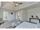 Spacious main bedroom boasting a tray ceiling, and a door to the ensuite bathroom at 11605 Dunhill Place Dr, Alpharetta, GA 30005