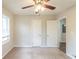 Bedroom with neutral carpet, a ceiling fan, a window, and a closet at 1624 Linda Dr, Decatur, GA 30032