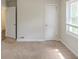 Bedroom with a window, a closet, neutral carpet and access to another room at 1624 Linda Dr, Decatur, GA 30032