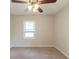 Bedroom with neutral colored carpet and a window at 1624 Linda Dr, Decatur, GA 30032