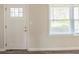Bright entryway showcasing a white door, fresh paint and wood-look flooring at 1624 Linda Dr, Decatur, GA 30032