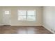 Inviting living room features wood-look flooring and fresh paint with ample natural light at 1624 Linda Dr, Decatur, GA 30032
